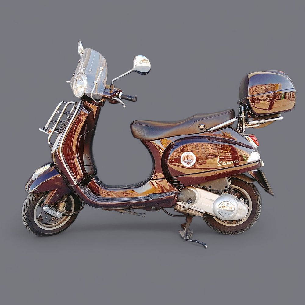 Vespa Piaggio LX 125 i.e. Piaggio LX 125 i.e. Vespa motorcycle in dark brown. In perfect 