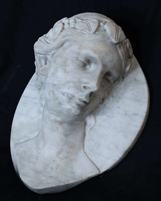 Anonymous European ca. 1940 - Female head. White veined marble sculpture depicting the turned 