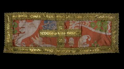Antique fabric brooch for a cloak. Date unknown. A cloak brooch made of embroidered silk 