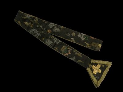 Stola with castles, c. 1750. A silk stole featuring gold and silver brocade work, in a dark 