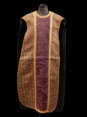 Chasuble 18th-century. Purple and yellow brocade chasuble with a damask central band. 18th century