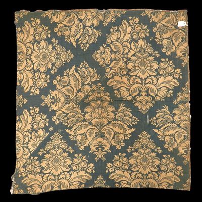 A fragment of white and blue silk fabric. Date unknown. A fragment of fabric made of blue silk 