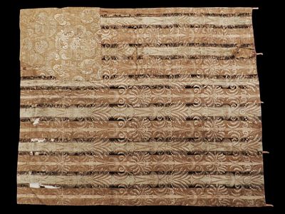 Textile. 17th century. A silk textile featuring bands in shades of ochre and brown, separated by 