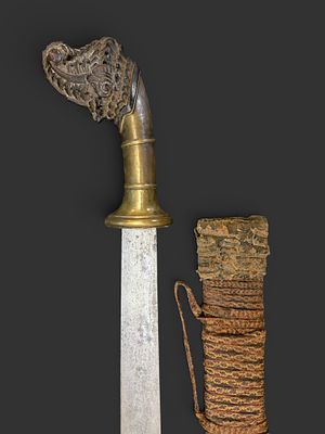 Indonesian machete, 19th century. Horn and brass handle. Wooden sheath. In good condition. 59 cm