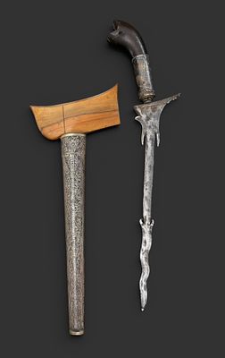 Kris, Malaysia, 19th century. Kris from Malaysia, 19th century. Dark wooden hilt with a silver 