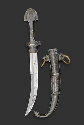 Moroccan gumia. 20th century. Moroccan gumia. Silver and brass scabbard. Blade signed ‘Agadero’ 