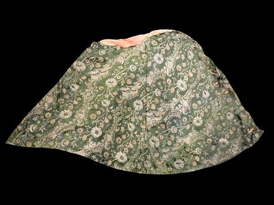 Antique cloak. Date unknown. An antique cape made of green silk, decorated with floral and plant 
