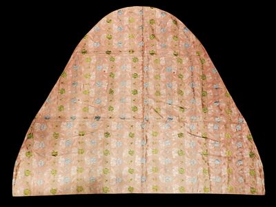Cape, late 18th century. A cape made of salmon-coloured silk, decorated with floral and plant 