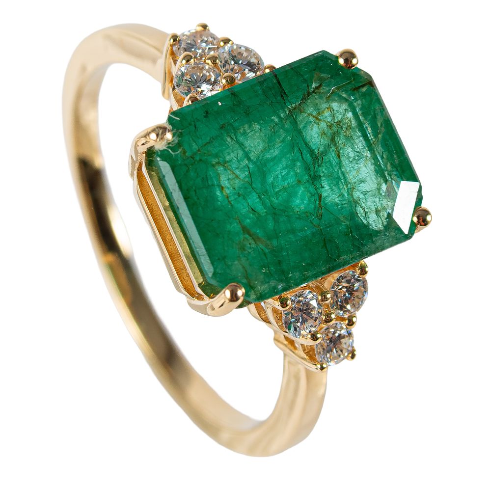 Sortija en oro con esmeralda custodiada diamantes. Sortija en oro con esmeralda talla 