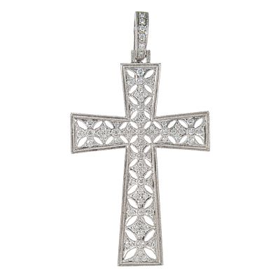 Colgante diseño cruz calada en oro blanco cuajada de diamantes. . Colgante diseño cruz calada en 