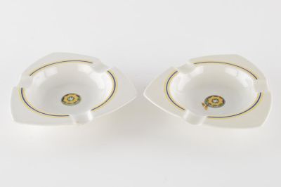 2ND ARMORED CAVALRY ASHTRAYS, ESTATE OF GEN. CLARENCE HUEBNER. A pair of German-made porcelain 
