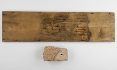 A BRICK AND A WOODEN PANEL FROM MARTIN BORMANN'S HOUSE IN OBERSALZBERG. Rare pair of 