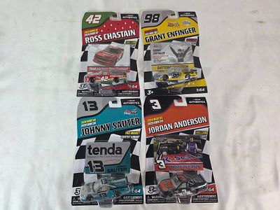 4 NASCAR 1:64 Diecast Trucks. Four NASCAR Truck Series 1:64 scale diecast replicas by Lionel