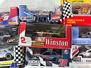 9 NASCAR 1:64 Scale Diecast Cars. Nine NASCAR 1:64 scale diecast cars featuring various iconic Image - 2