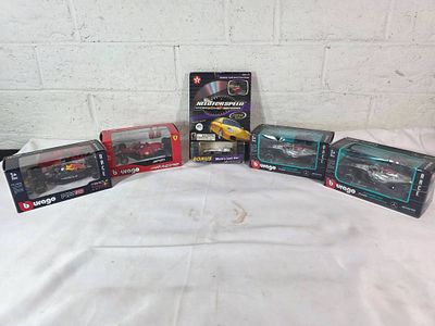 1:43 and 1:64 Diecast Formula and Indy Cars. A group of six diecast models in original packaging