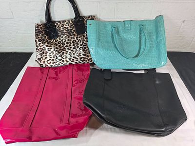 Four Women’s Handbags. Four women's handbags in various styles and materials. Includes a