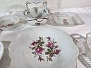White Glass Serving Dishes with Floral Designs. Eight white glass serving dishes featuring Image - 1