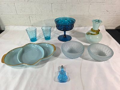 Blue Glass Decorative Items. Blue glass items, including a lidded goblet with a pedestal base