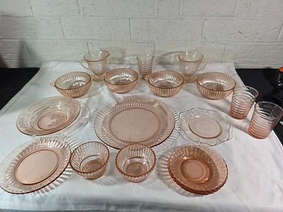 Pink Depression Glass Tableware. Pink Depression glass tableware comprising various dish types