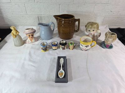 Ceramic Pitchers, Mugs, and Figurines. Collection of ceramic items including a large brown