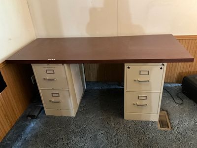 Metal Desk withÂ File Drawers. Metal office desk featuring a rectangular wood laminate top and 