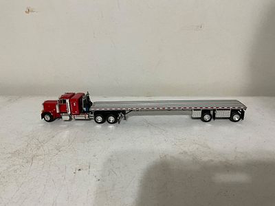 Â Semi Truck with Flatbed Trailer. Die-cast model semi truck with an attached flatbed trailer. 