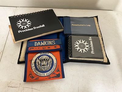 Skydiving Documents. Skydiving-related materials, including multiple logbooks marked 