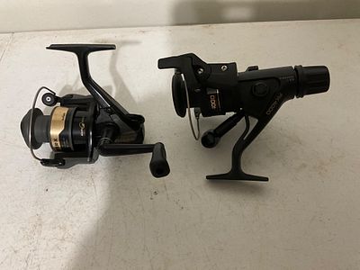 TwoÂ Fishing Reels. Two spinning fishing reels including one marked FX4000 and one marked 