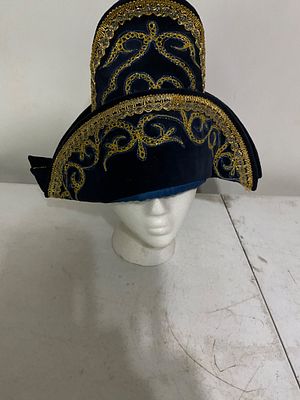 Blue Velvet Hat With Gold Embroidery. Blue velvet hat featuring ornate gold embroidery on the 