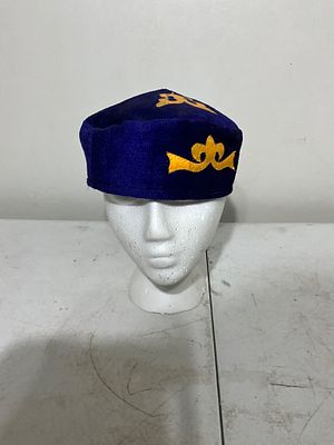 Blue Fabric Cap with Yellow Embroidered Motifs. Blue fabric cap featuring yellow embroidered 