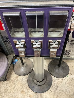 Triple-Compartment Coin-Operated Vending Machine. Triple-compartment coin-operated vending 