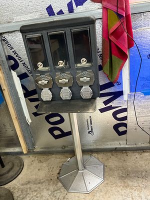 Tri-Compartment Coin-Operated Vending Machine. Tri-compartment coin-operated vending machine 