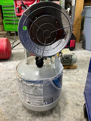 Propane Tank with Heater Attachment. Propane tank, labeled 'Blue Rhino,' equipped with an 
