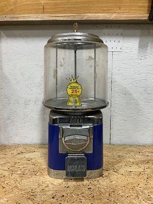 Richland Coin-Operated Candy Dispenser. A vintage coin-operated Richland candy or gumball 