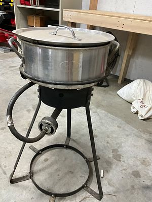 Outdoor Propane Cooker with Aluminum Pot. Outdoor propane cooker with a sturdy metal frame 