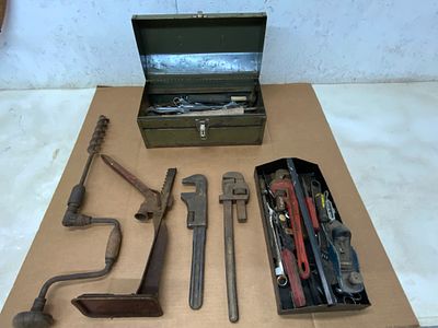 Hand Tools with Metal Toolbox. Hand tools housed in a vintage green metal toolbox labeled 