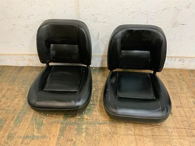 Black Vinyl Automotive Bucket Seats. Matching black automotive bucket seats upholstered in 