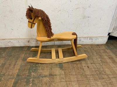 Wooden Rocking Horse with Fabric Mane. Wooden rocking horse featuring a light wood finish. The 
