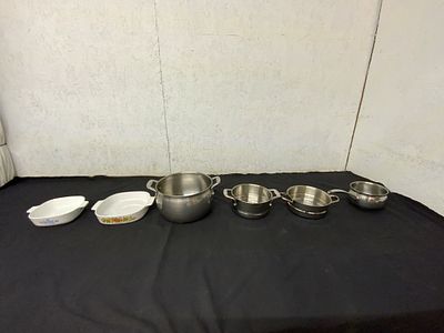 6 Bakeware and Cookware Pieces. Six cookware and bakeware pieces, including two ceramic baking 