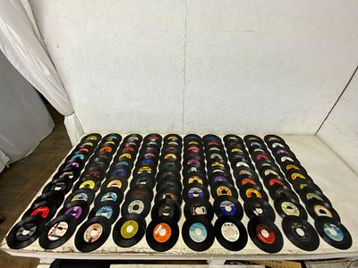 100 Assorted 7-Inch Vinyl Records. 100 assorted 7-inch vinyl records featuring various labels 