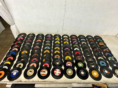 100 Vintage 45 RPM Records. 100 vinyl 45 RPM records featuring a variety of labels, genres, and 