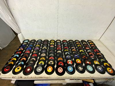 100 Assorted 45 RPM Vinyl Records. 100 assorted 7-inch 45 RPM vinyl records featuring a variety 