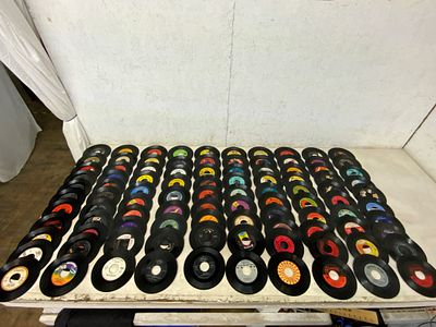 100 Vinyl 45 RPM Records. Approximately 100 vinyl 45 RPM records from various labels, such as 