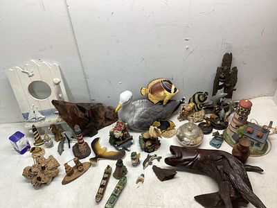 Nautical-Themed Decor. Over 20 nautical-themed decorative items, including lighthouse figurines