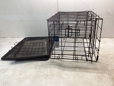 Wire Pet Crate with Removable Trays. Metal wire pet crate with two removable plastic trays and a