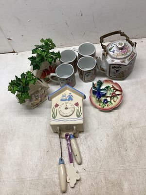 Decorative Tea Set and Figurines. An eclectic mix of decorative and functional items: a floral