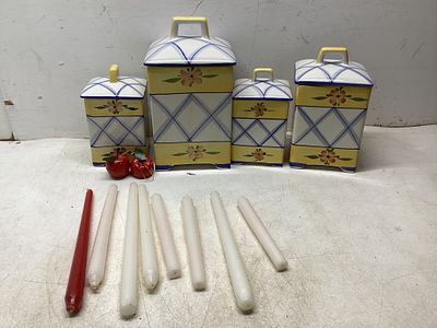 4 Ceramic CanistersÂ. Four ceramic canisters featuring a yellow, blue, and floral pattern with