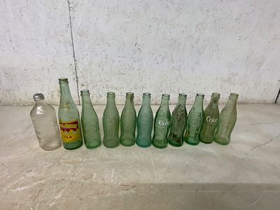 11 Vintage Glass Beverage BottlesÂ. 11 vintage glass beverage bottles, featuring brands such as