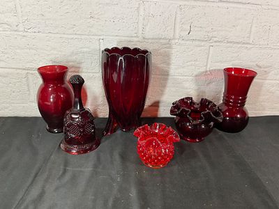 Six Red Glass Vessels. Six ruby red glass vessels, including a variety of vases and decorative