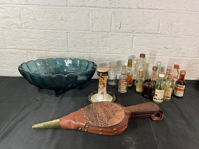 Decorative Items and Small Bottles. An assortment of items: a large blue glass pedestal bowl